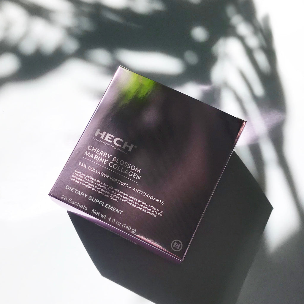 Close-up of HECH Cherry Blossom Marine Collagen luxury supplement packaging