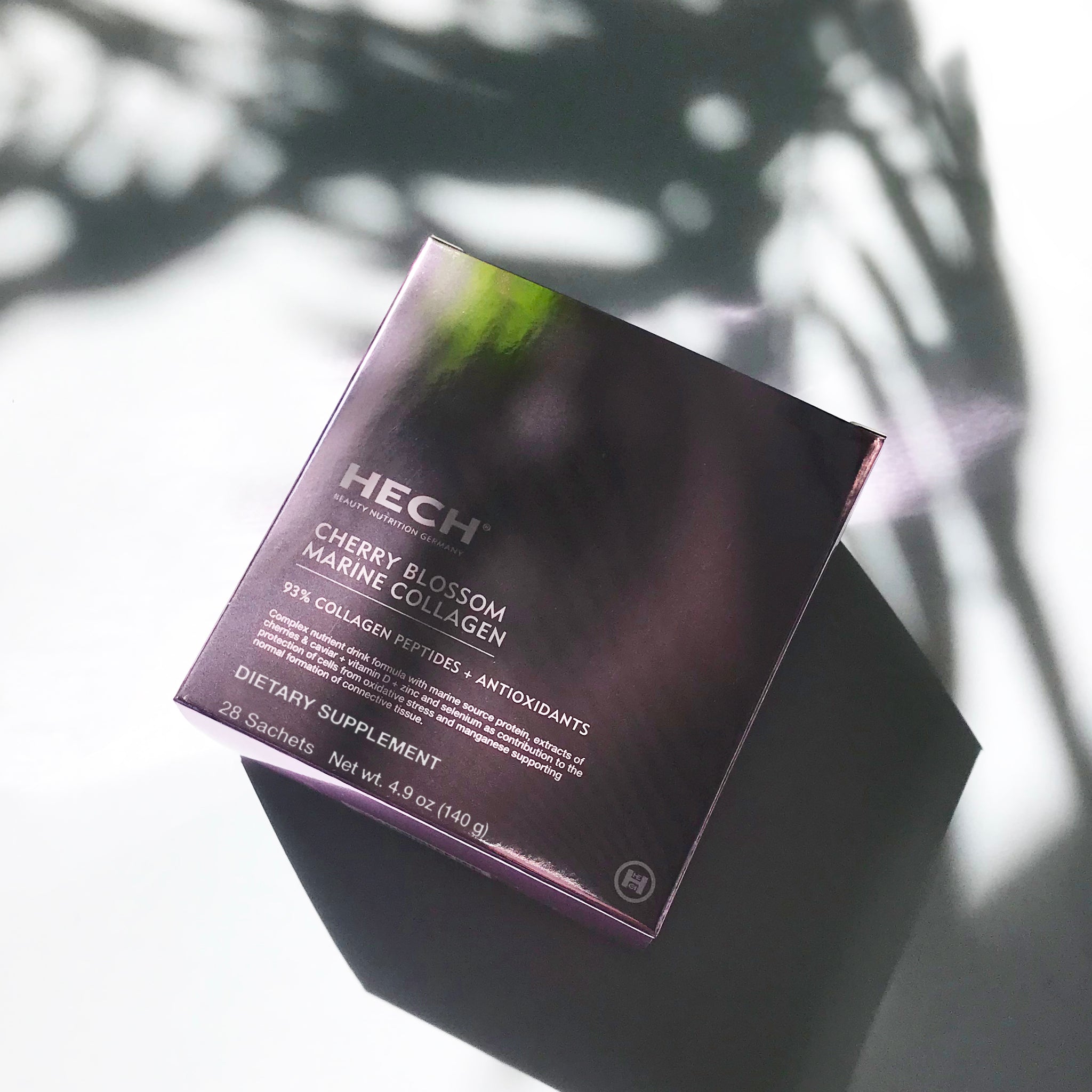 Close-up of HECH Cherry Blossom Marine Collagen luxury supplement packaging